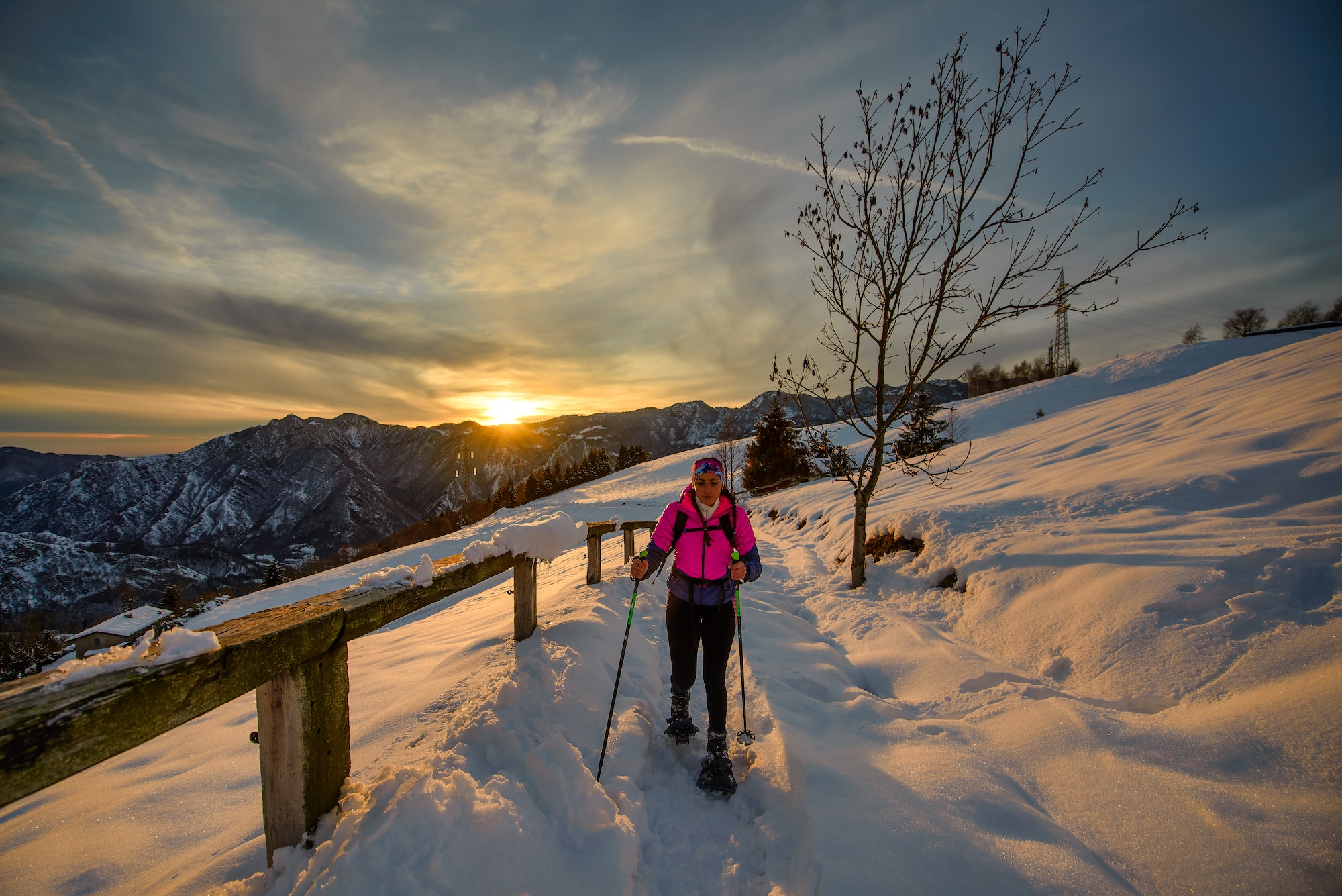 Young woman alone on snowshoe hike